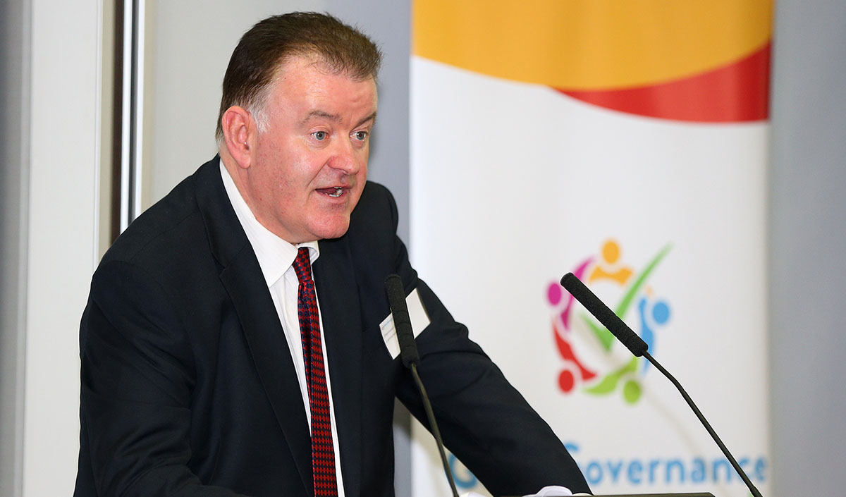 Diarmaid Ó Corrbuí, CEO of Carmichael, speaking at a lectern